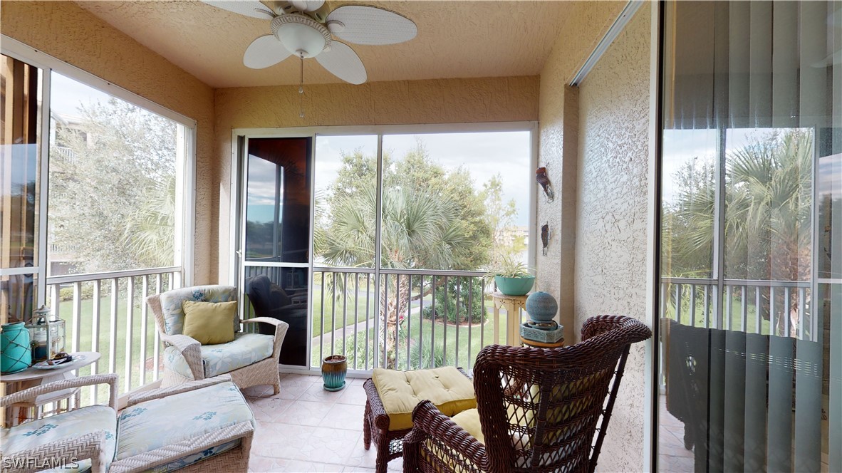 14111 Brant Point Circle, Unit 2201 Fort Myers, FL 33919 - Photo 19 of 30 a living room with furniture and a large window
