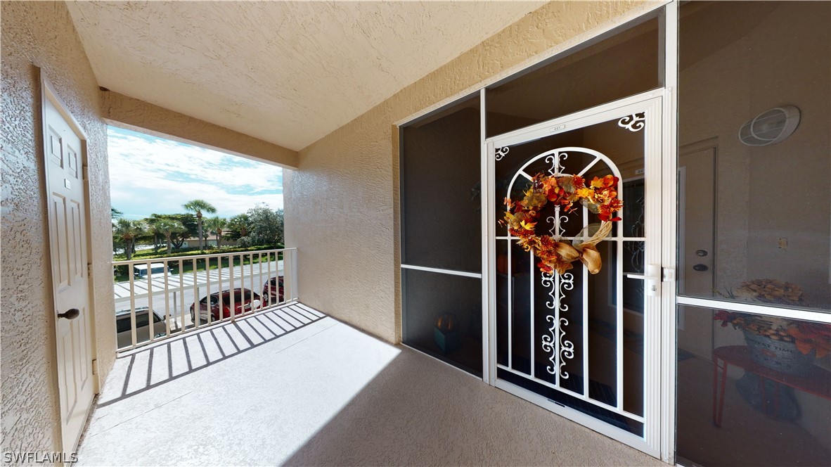 14111 Brant Point Circle, Unit 2201 Fort Myers, FL 33919 - Photo 2 of 30 a view of a entryway door of the house