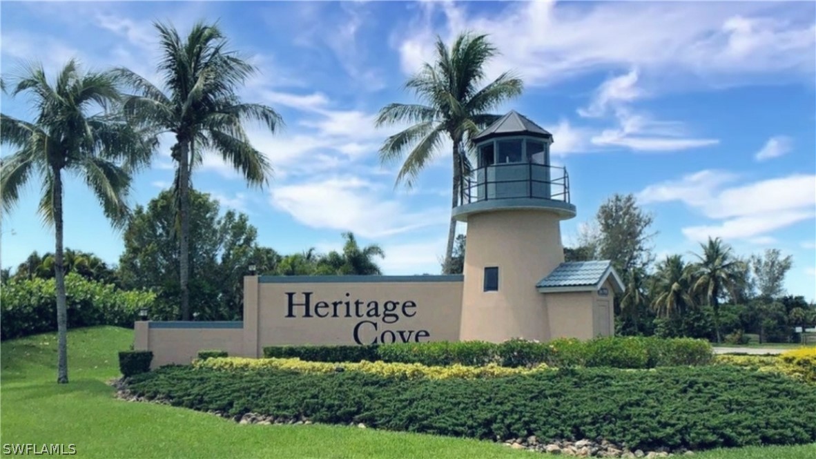 14111 Brant Point Circle, Unit 2201 Fort Myers, FL 33919 - Photo 23 of 30 a sign that is sitting on top of a building with potted plants