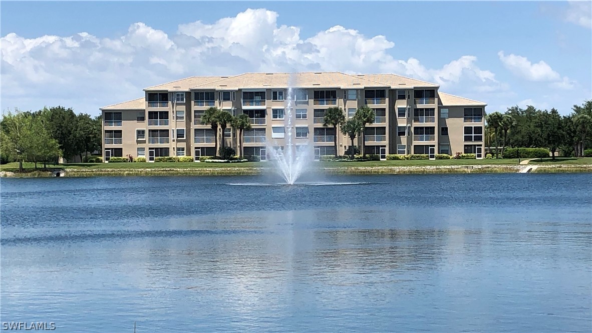 14111 Brant Point Circle, Unit 2201 Fort Myers, FL 33919 - Photo 24 of 30 a view of multiple houses with a yard