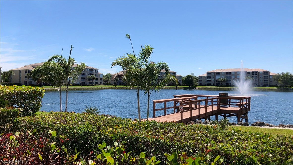 14111 Brant Point Circle, Unit 2201 Fort Myers, FL 33919 - Photo 25 of 30 a backyard of a house with table and chairs
