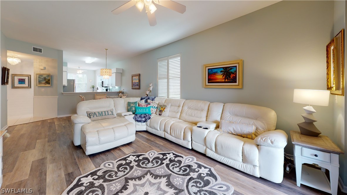 14111 Brant Point Circle, Unit 2201 Fort Myers, FL 33919 - Photo 3 of 30 a living room with furniture and a rug