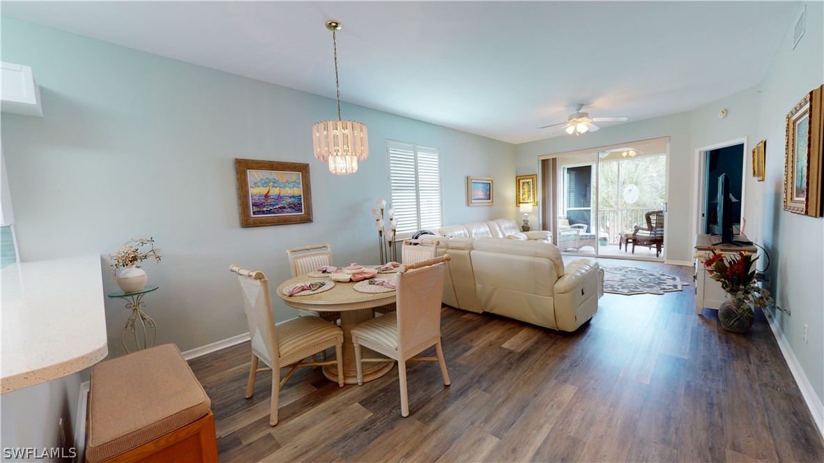 14111 Brant Point Circle, Unit 2201 Fort Myers, FL 33919 - Photo 5 of 30 a living room with fireplace furniture and a wooden floor