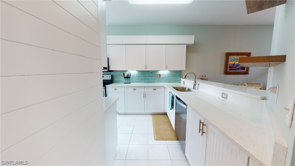 14111 Brant Point Circle, Unit 2201 Fort Myers, FL 33919 - Photo 6 of 30 a utility room with sink dryer and washer