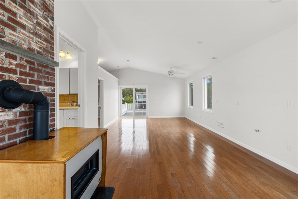 16 Reservation Road Fairhaven, MA 02719 - Photo 24 of 39 a view of a kitchen and an empty room with wooden floor