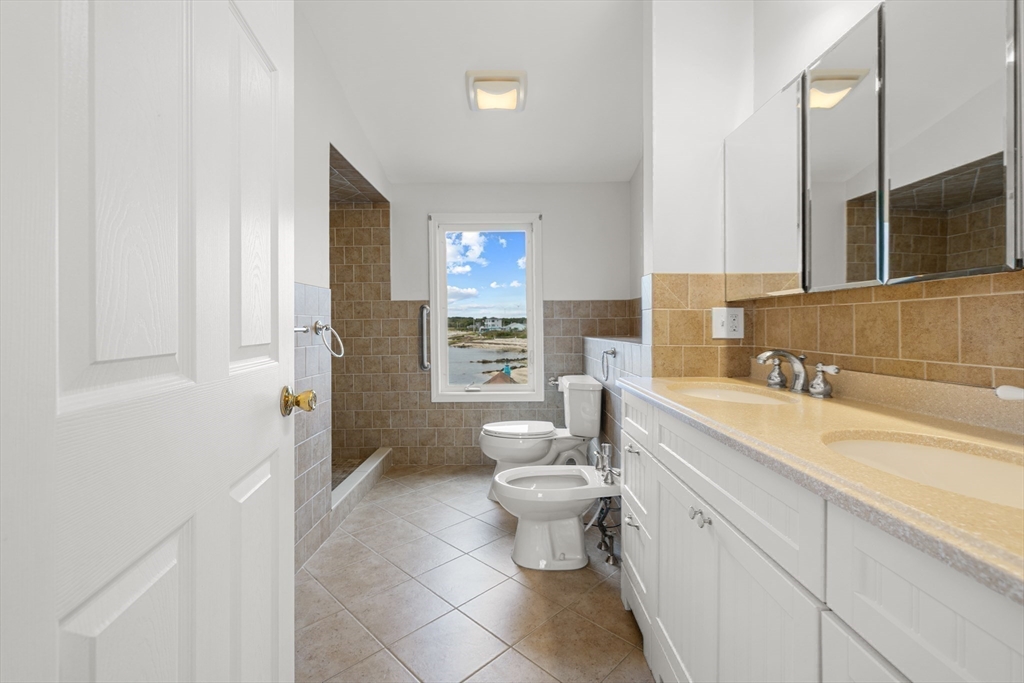 16 Reservation Road Fairhaven, MA 02719 - Photo 26 of 39 a bathroom with a sink a toilet and shower