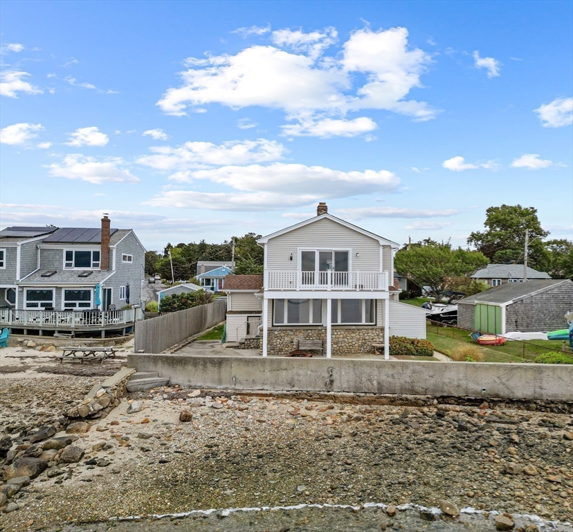 16 Reservation Road Fairhaven, MA 02719 - Photo 35 of 39 a view of a white house next to a yard with big trees