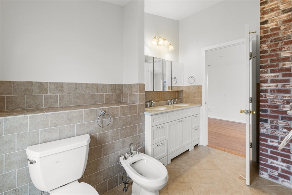 16 Reservation Road Fairhaven, MA 02719 - Photo 9 of 39 a bathroom with a toilet sink and mirror