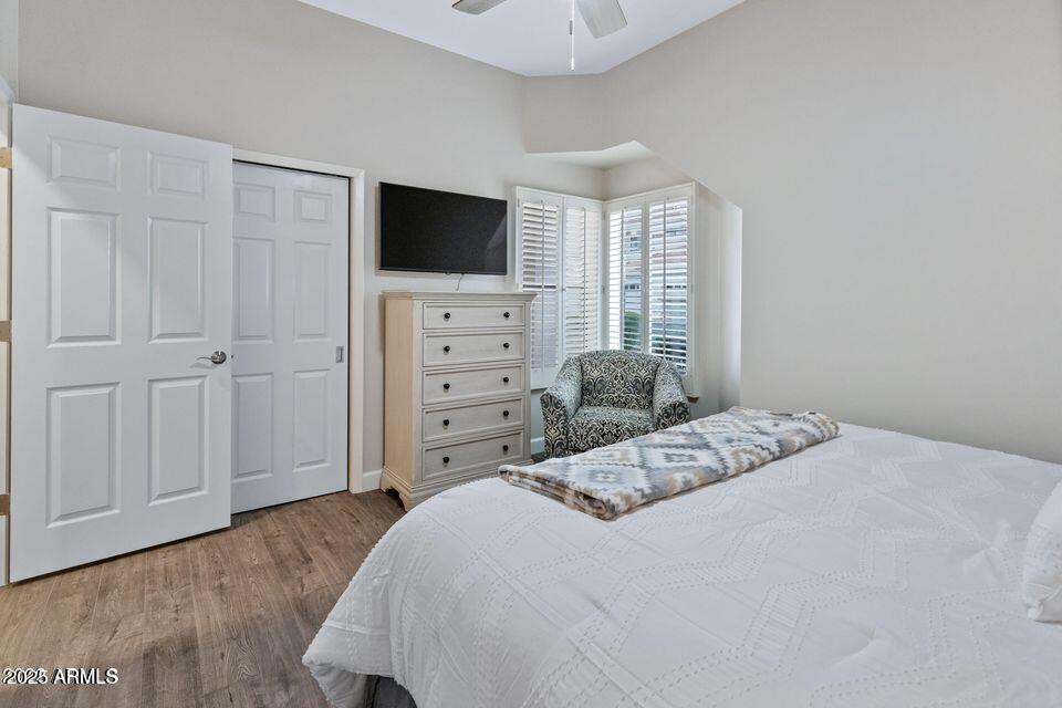 8270 North Hayden Road, Unit 1028 Scottsdale, AZ 85258 - Photo 14 of 22 a bedroom with a bed tv and a window