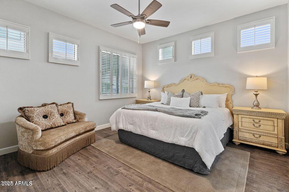 8270 North Hayden Road, Unit 1028 Scottsdale, AZ 85258 - Photo 6 of 22 a bedroom with a bed and a couch