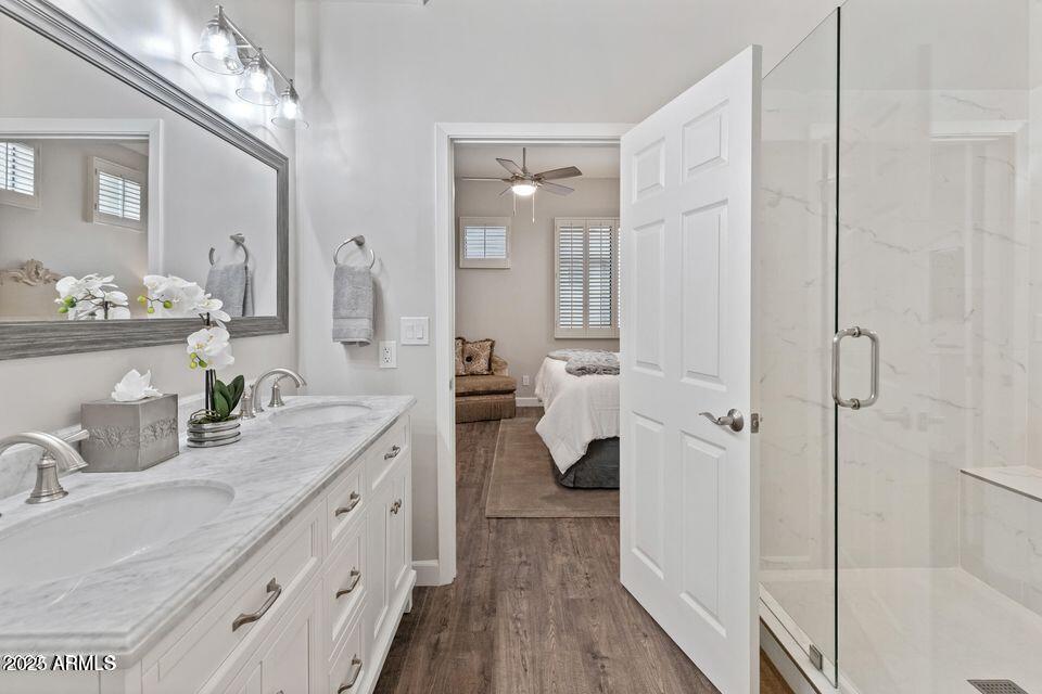 8270 North Hayden Road, Unit 1028 Scottsdale, AZ 85258 - Photo 7 of 22 a spacious bathroom with a granite countertop sink mirror and shower