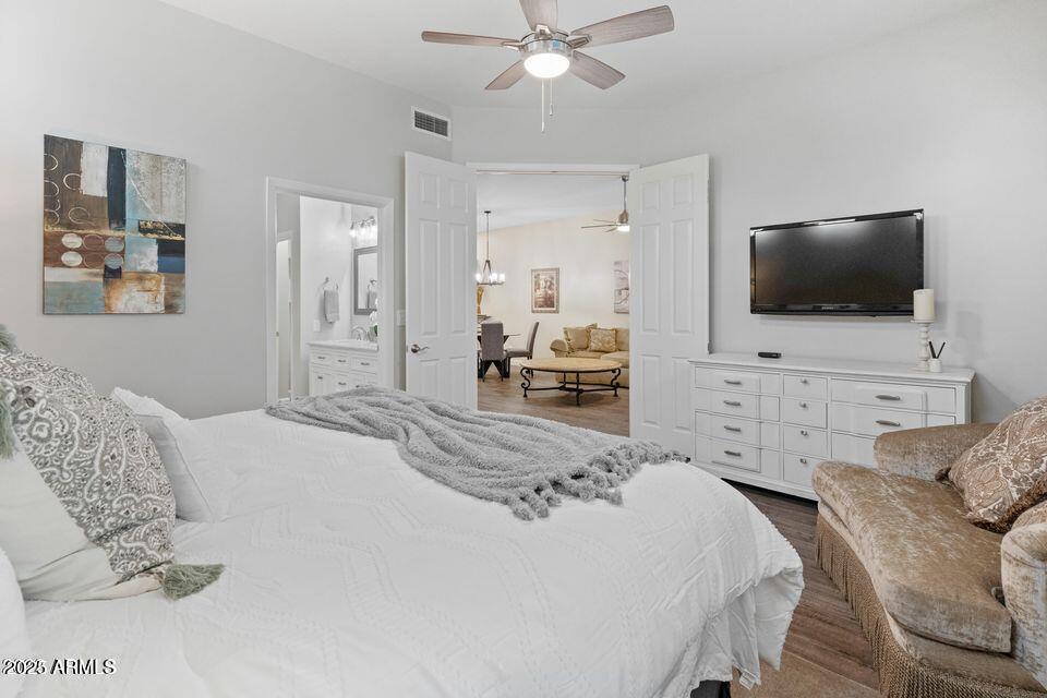 8270 North Hayden Road, Unit 1028 Scottsdale, AZ 85258 - Photo 8 of 22 a bedroom with a bed and a flat screen tv