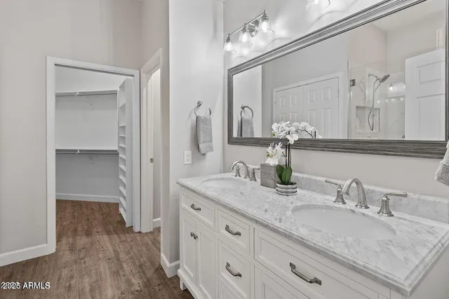 a bathroom with a granite countertop sink vanity granite and a mirror