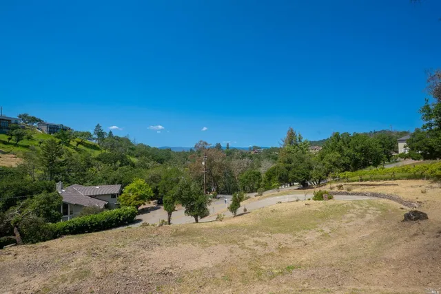 a view of a road with a building in the background