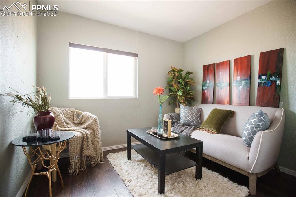 6605 Lauppe Road Yoder, CO 80864 - Photo 17 of 38 a living room with furniture and wooden floor