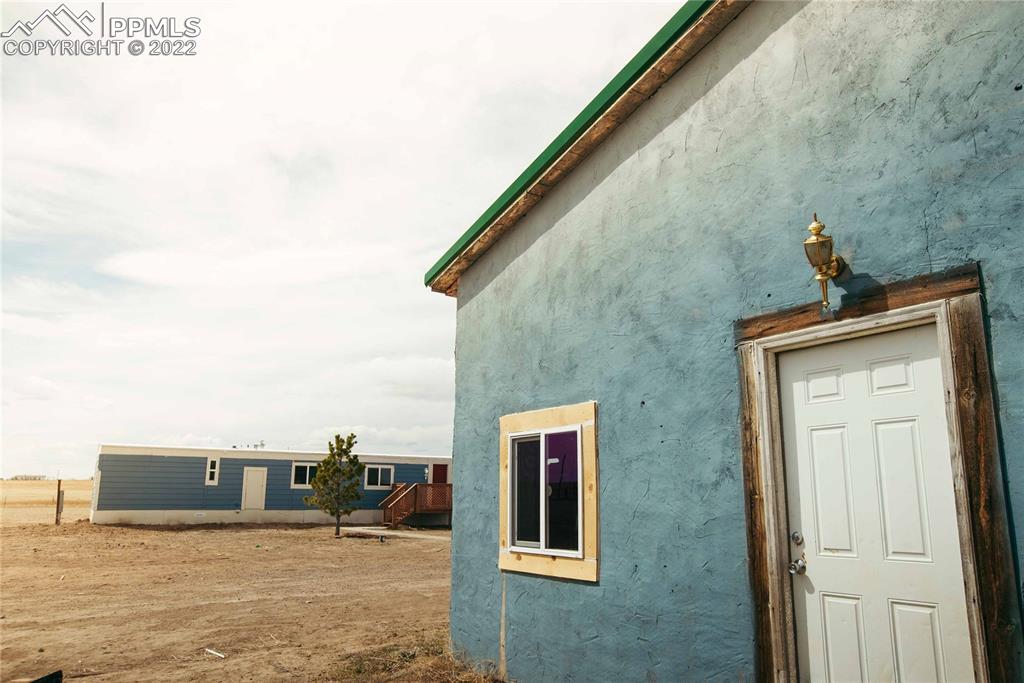 6605 Lauppe Road Yoder, CO 80864 - Photo 24 of 38 a view of a house with a outdoor space