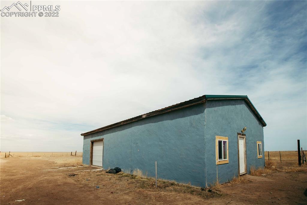 6605 Lauppe Road Yoder, CO 80864 - Photo 25 of 38 a house view with a backyard space