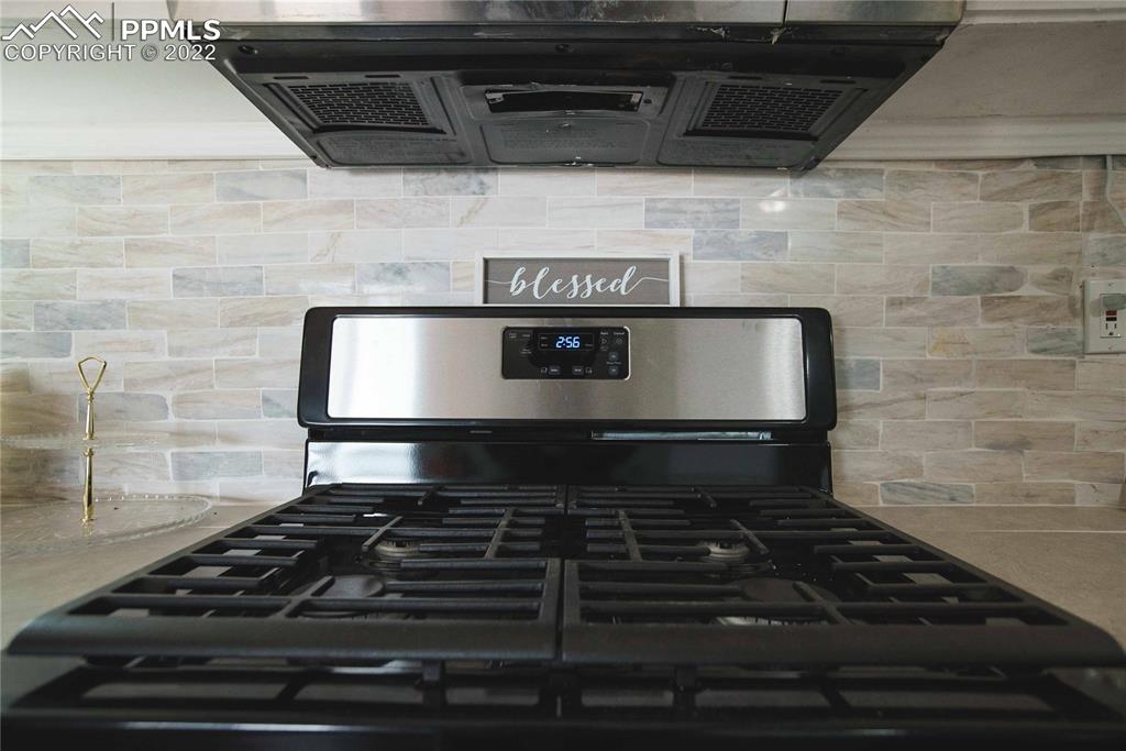 6605 Lauppe Road Yoder, CO 80864 - Photo 9 of 38 a stove top oven sitting inside of a kitchen