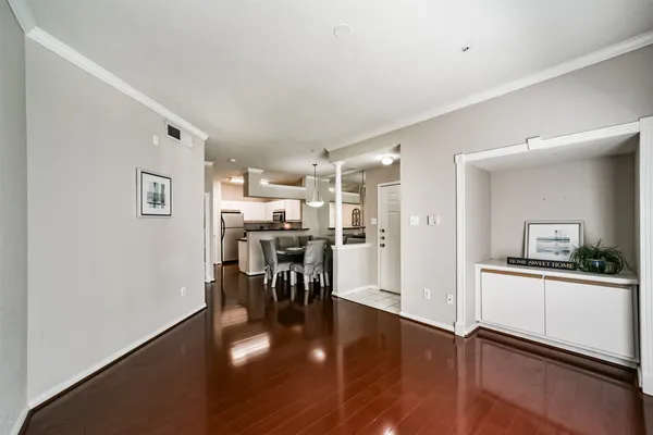 a kitchen with a refrigerator and a table