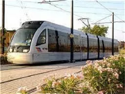 a front view of a house with a yard and outdoor seating