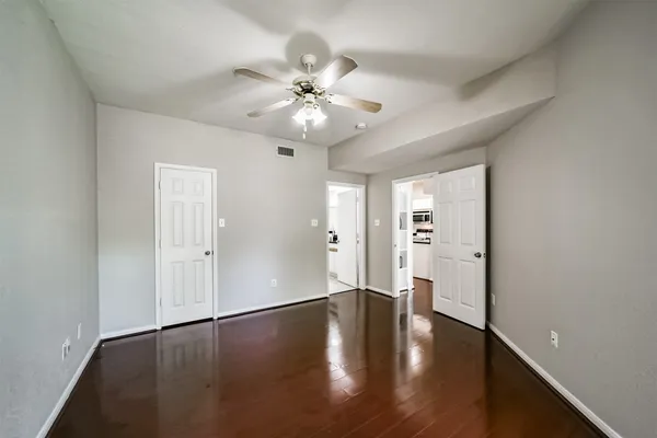 a white bath tub sitting next to a white toilet and sink