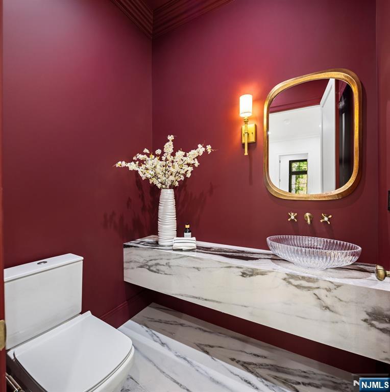 16 Old Farms Road Saddle River, NJ 07458 - Photo 14 of 31 a bathroom with a toilet sink and mirror