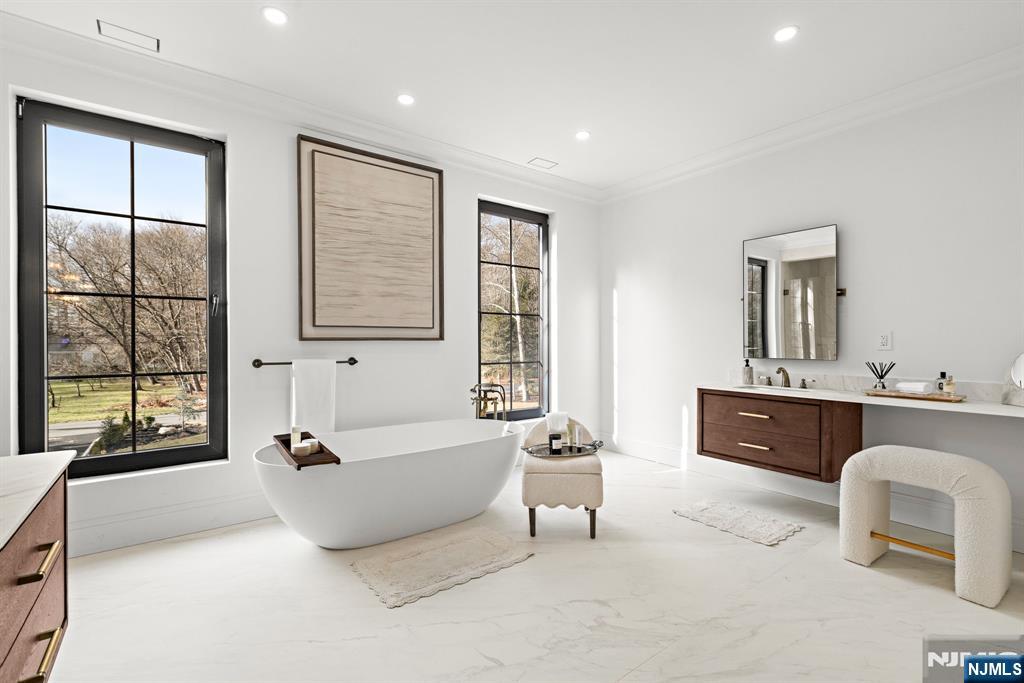 16 Old Farms Road Saddle River, NJ 07458 - Photo 19 of 31 a spacious bedroom with a large bed and a window