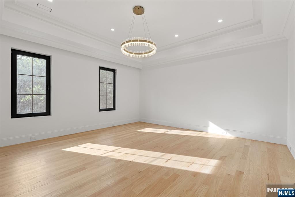 16 Old Farms Road Saddle River, NJ 07458 - Photo 22 of 31 a view of an empty room with wooden floor and windows