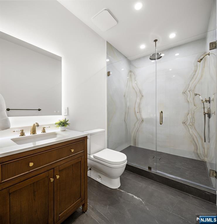 16 Old Farms Road Saddle River, NJ 07458 - Photo 25 of 31 a bathroom with a toilet sink and shower