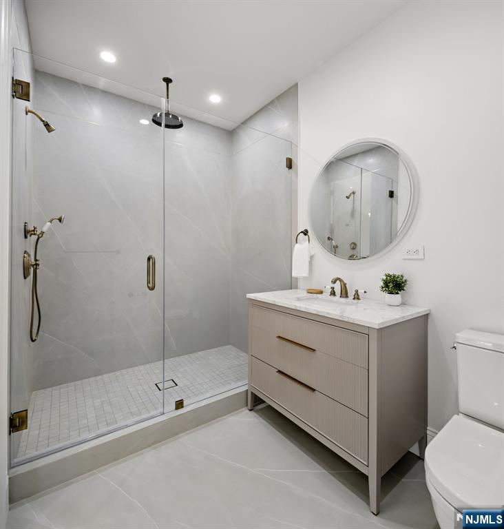16 Old Farms Road Saddle River, NJ 07458 - Photo 27 of 31 a bathroom with a sink mirror vanity and toilet