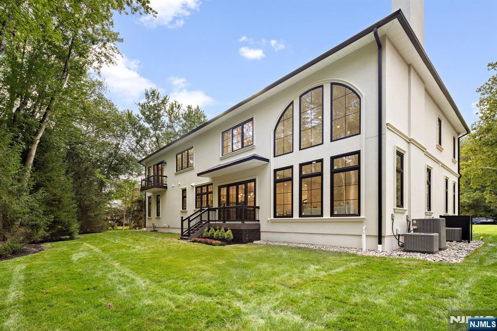 16 Old Farms Road Saddle River, NJ 07458 - Photo 30 of 31 a view of a house with backyard porch and sitting area