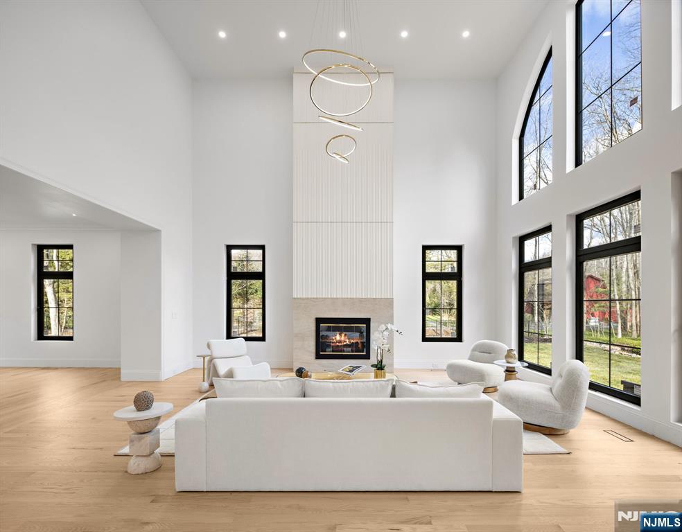 16 Old Farms Road Saddle River, NJ 07458 - Photo 10 of 31 a living room with furniture fireplace and flat screen tv