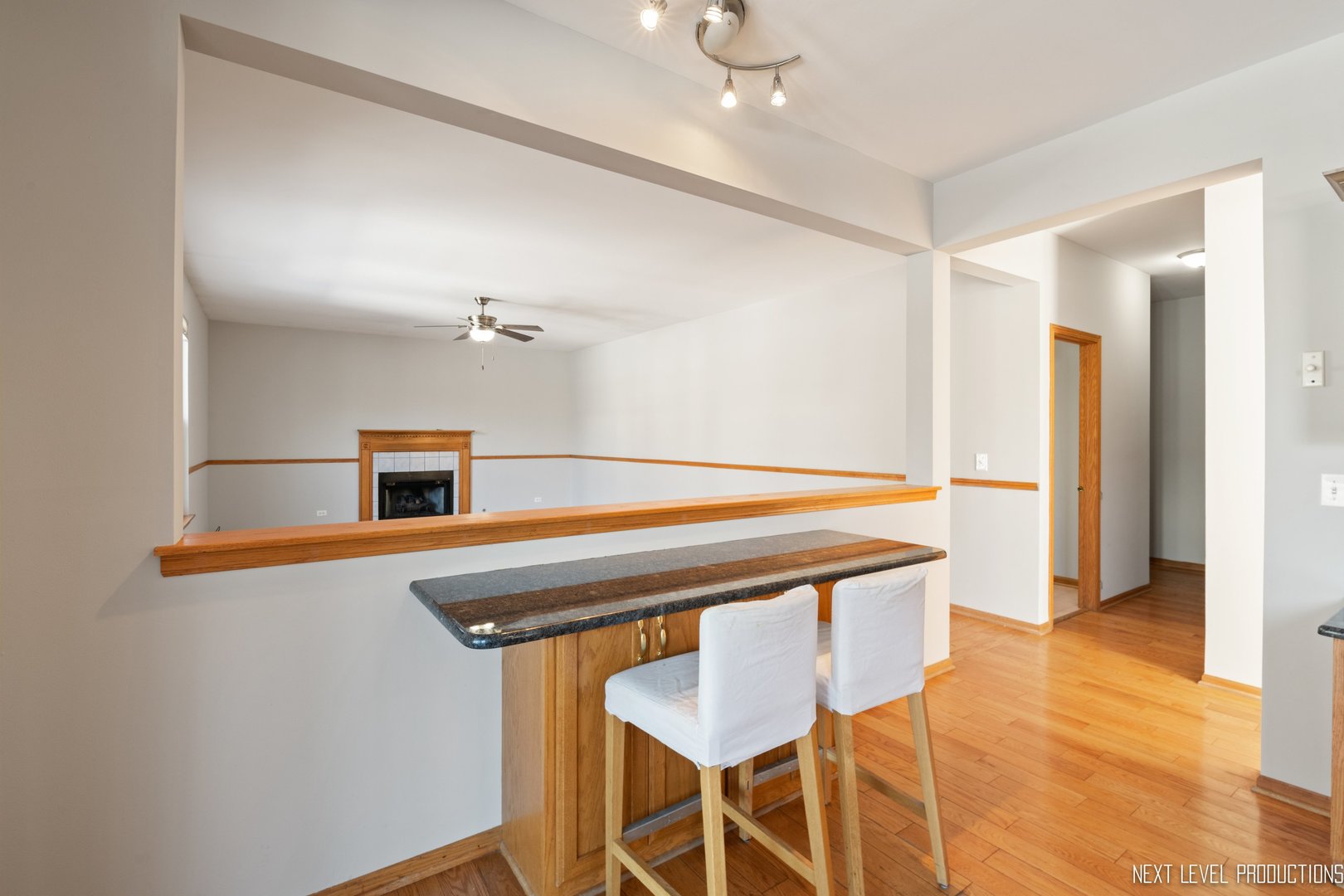 1772 Pinnacle Drive Aurora, IL 60502 - Photo 15 of 48 a kitchen with stainless steel appliances granite countertop a sink cabinets and wooden floor