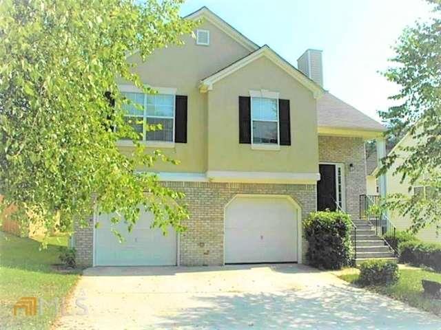 1006 Crest Ridge Place Southwest, Unit 2700 Marietta, GA 30060 - Photo 1 of 1 a front view of a house with garden