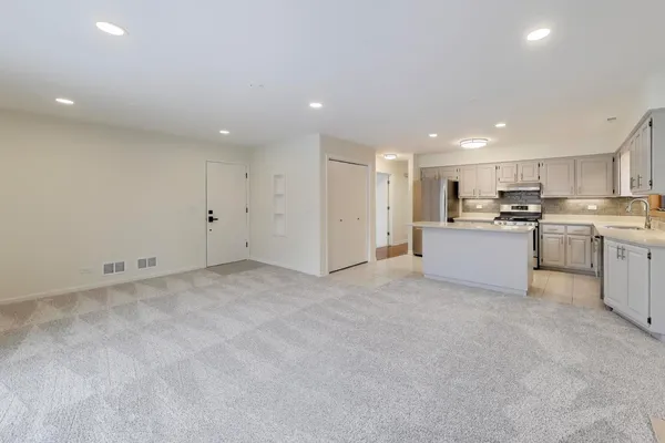 a view of a kitchen with a sink and microwave