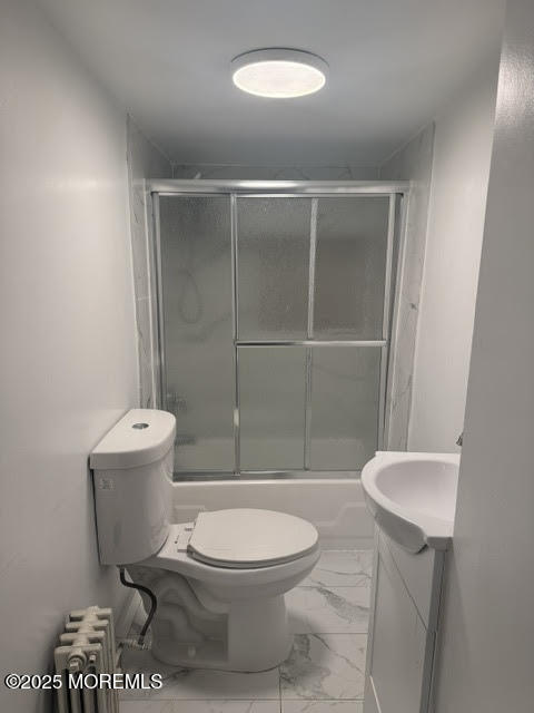 79 4th Avenue, Unit 1 Long Branch, NJ 07740 - Photo 5 of 11 a bathroom with a toilet a sink and shower