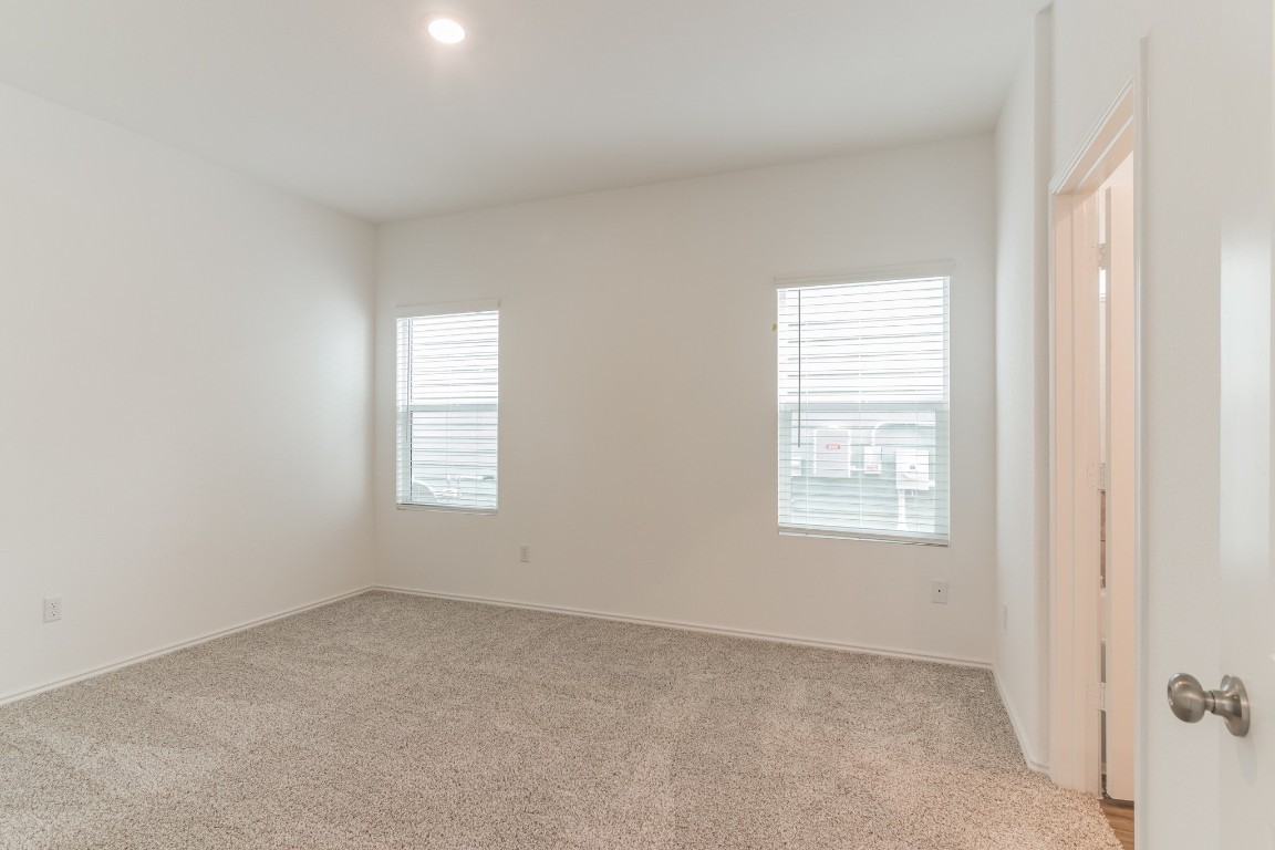 231 Rioja Kyle, TX 78640 - Photo 16 of 29 Unfurnished bedroom featuring light colored carpet and baseboards
