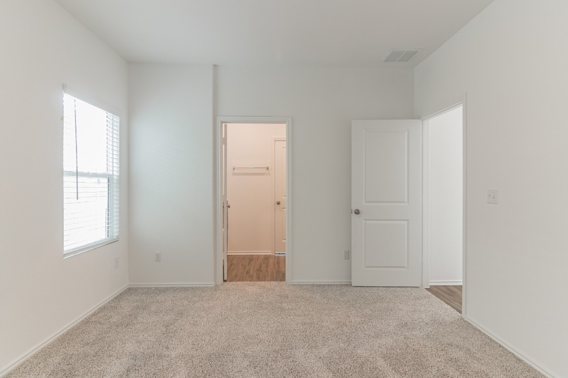 231 Rioja Kyle, TX 78640 - Photo 17 of 29 Unfurnished bedroom featuring light carpet