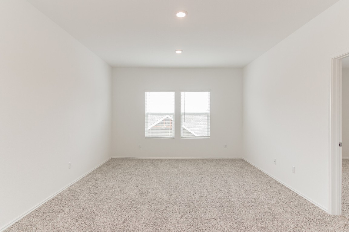 231 Rioja Kyle, TX 78640 - Photo 21 of 29 Spare room with light carpet and recessed lighting