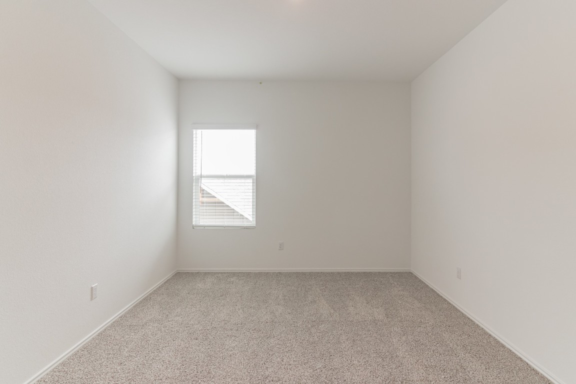 231 Rioja Kyle, TX 78640 - Photo 25 of 29 Spare room featuring carpet flooring and baseboards