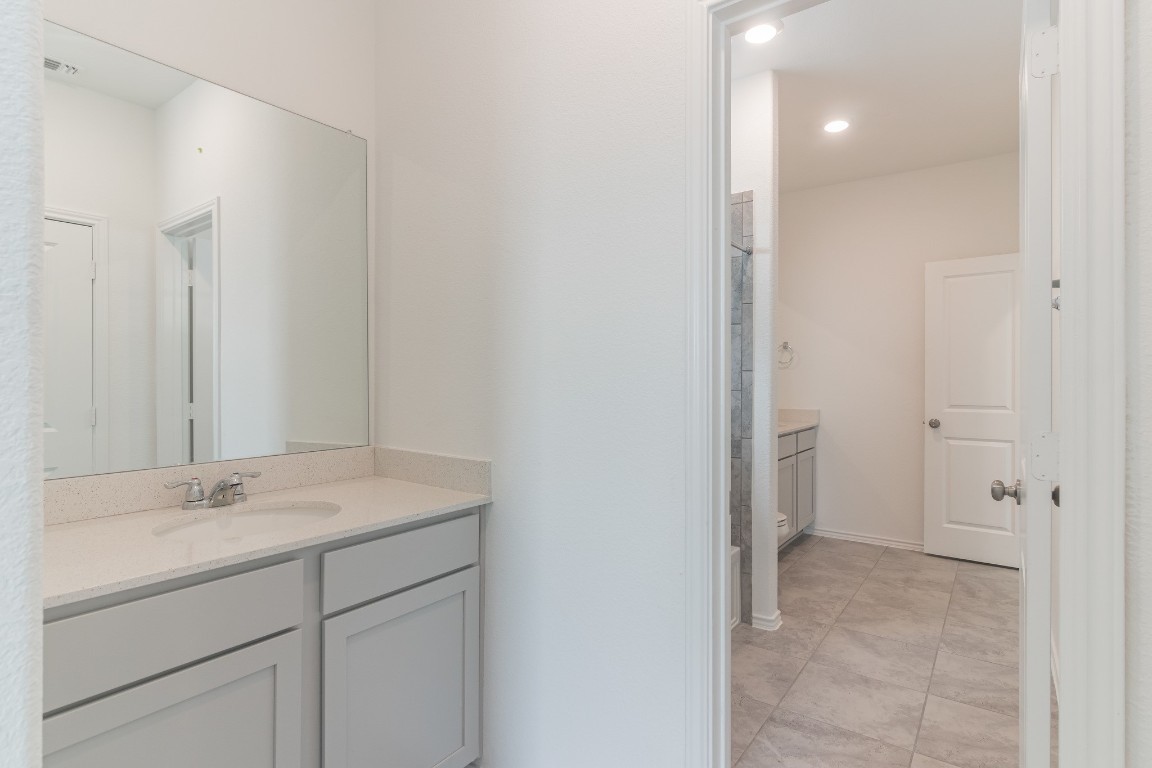 231 Rioja Kyle, TX 78640 - Photo 26 of 29 Bathroom featuring vanity and recessed lighting