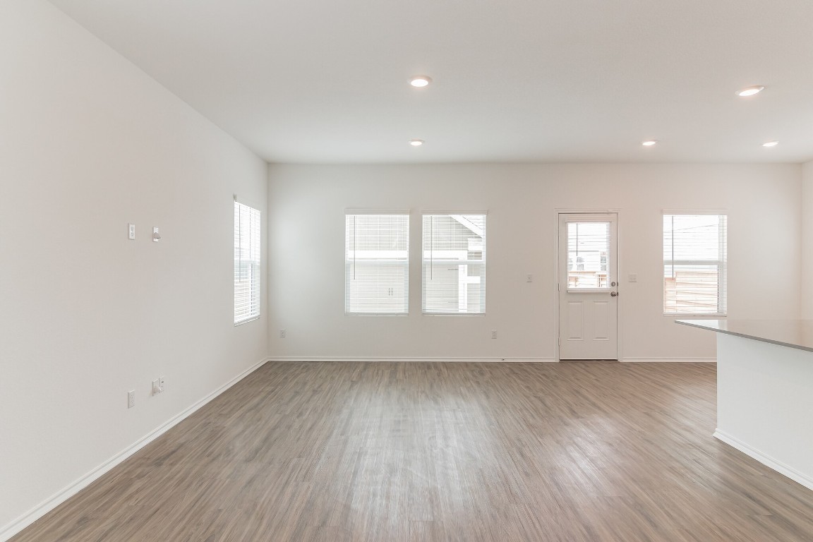 231 Rioja Kyle, TX 78640 - Photo 3 of 29 Unfurnished living room with light wood-type flooring, plenty of natural light, and recessed lighting