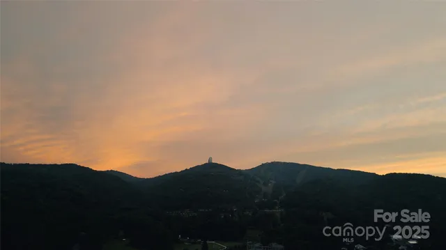 a view of mountains and valleys