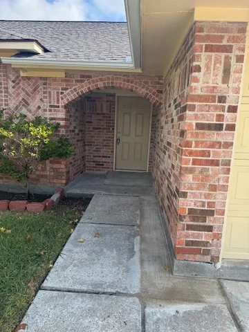 a view of front door of house with stairs