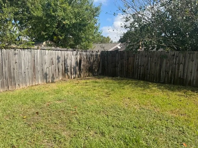 a view of a backyard of the house