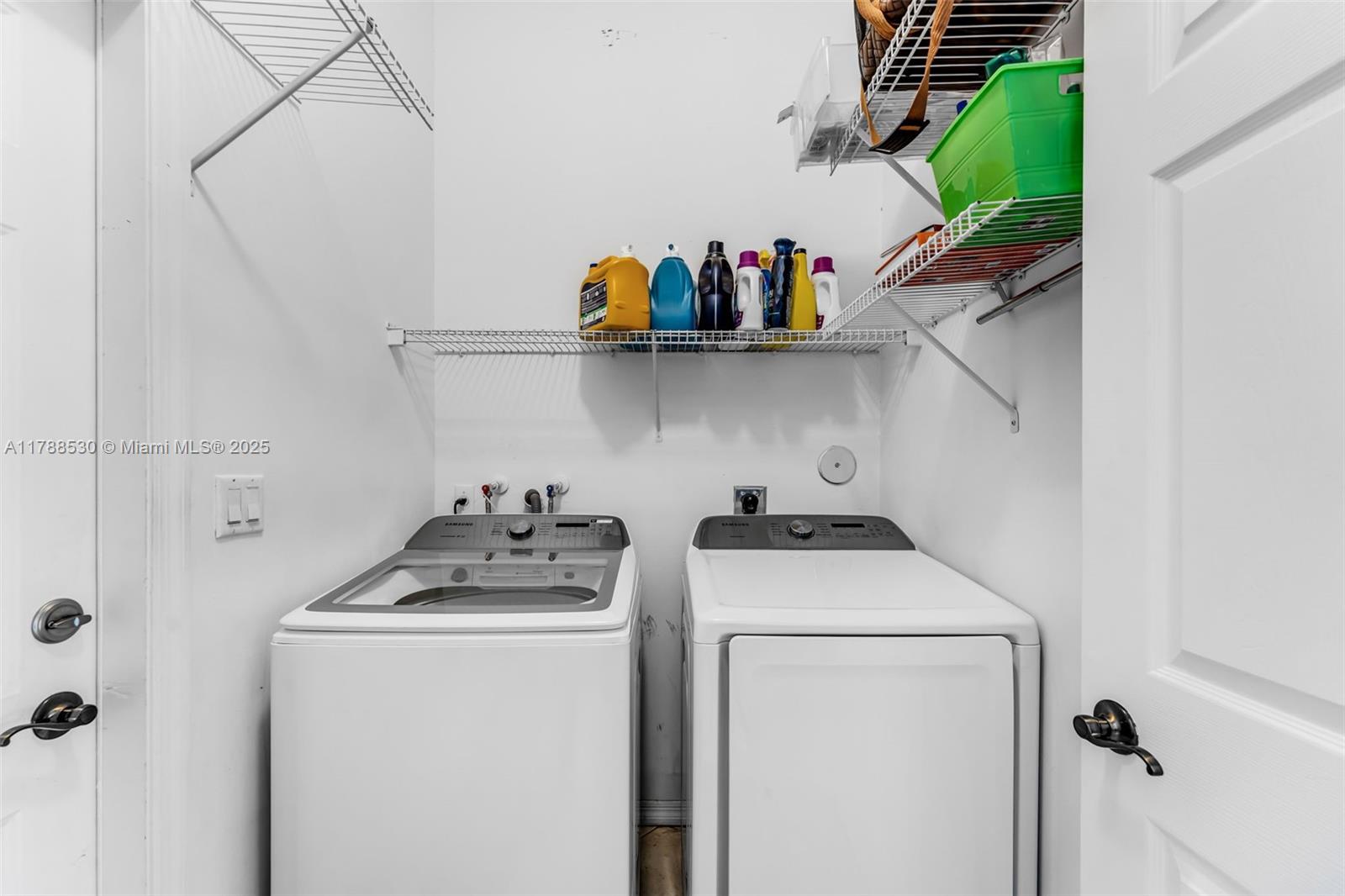 2819 Augusta Lane Homestead, FL 33035 - Photo 19 of 24 a view of washer and dryer with kitchen racks