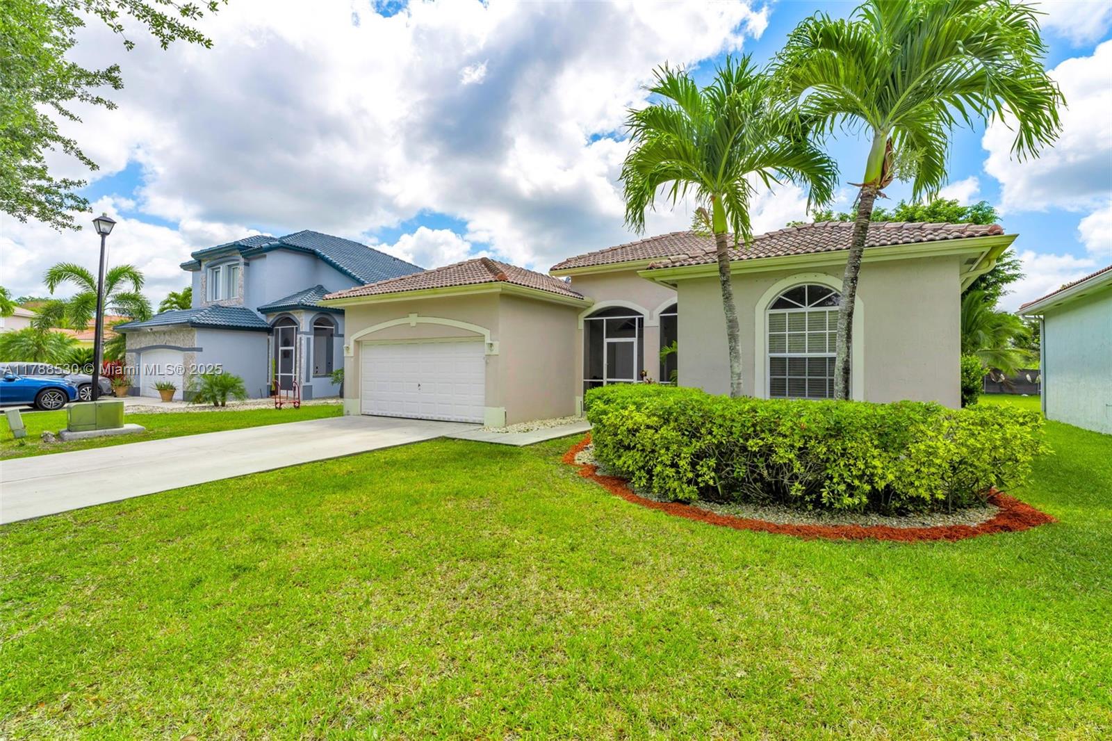 2819 Augusta Lane Homestead, FL 33035 - Photo 2 of 24 a front view of house with yard and green space