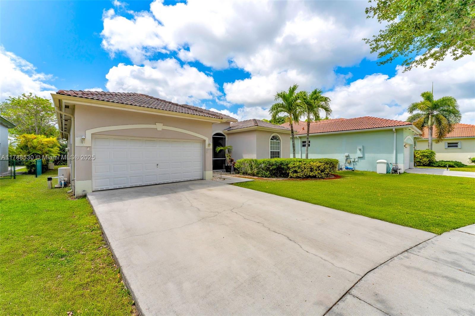 2819 Augusta Lane Homestead, FL 33035 - Photo 24 of 24 a front view of a house with garden