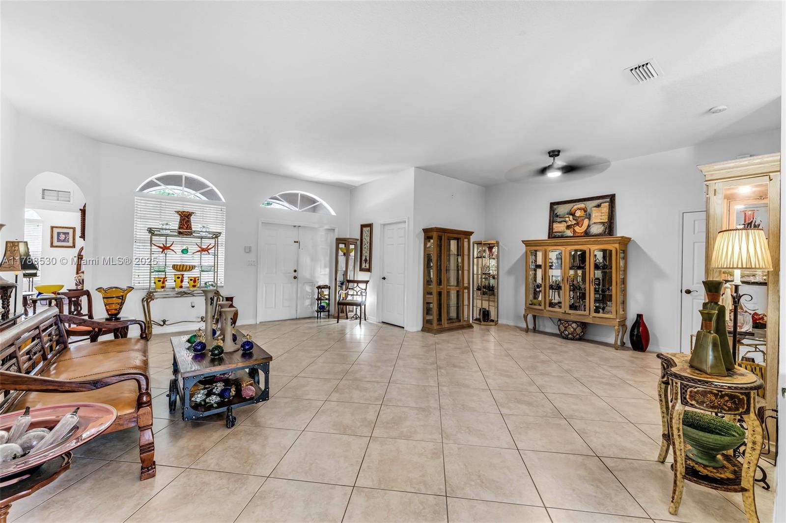2819 Augusta Lane Homestead, FL 33035 - Photo 6 of 24 a view of a livingroom with furniture and a large window