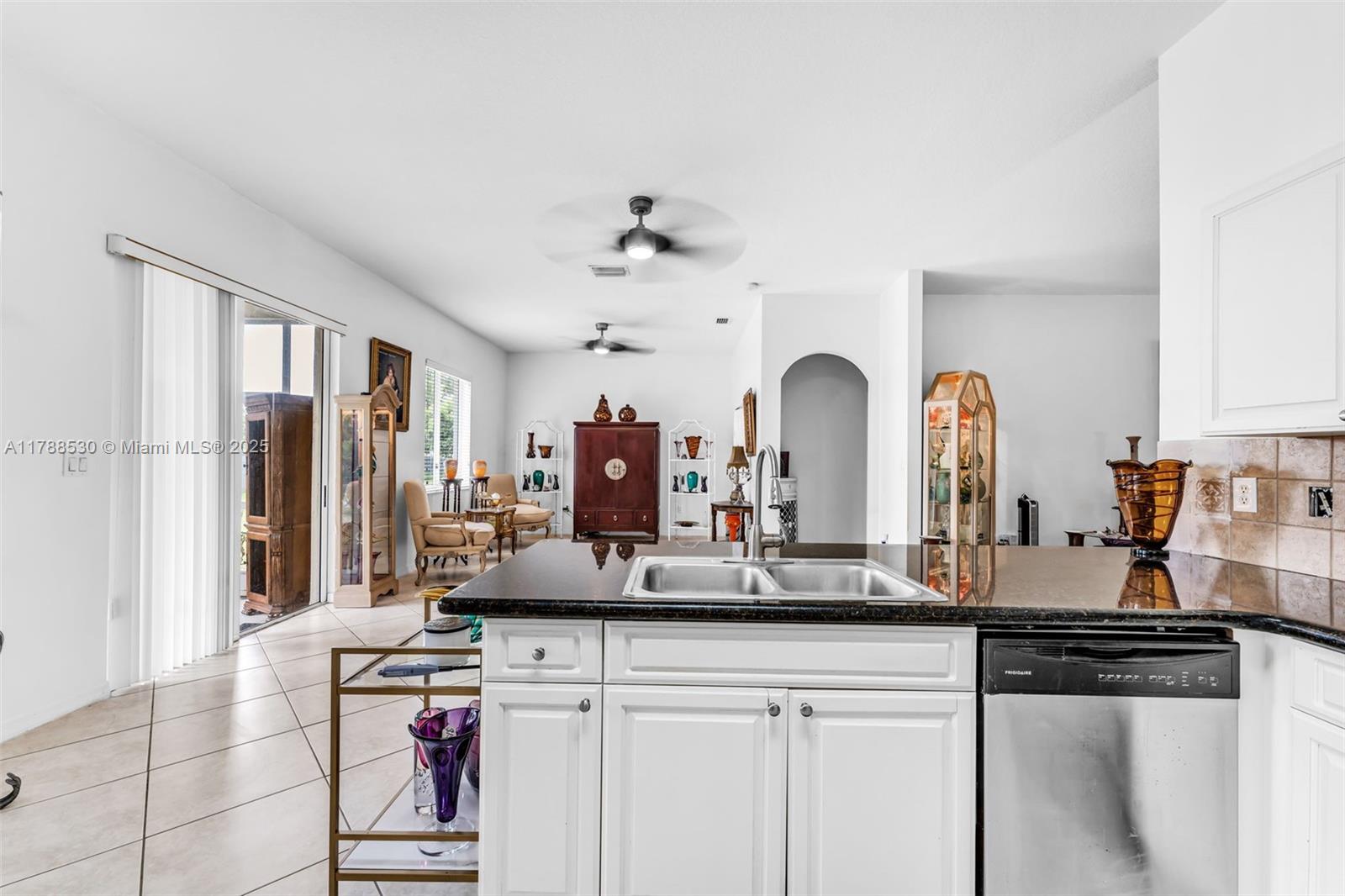 2819 Augusta Lane Homestead, FL 33035 - Photo 9 of 24 a view of living room with granite countertop furniture and large window